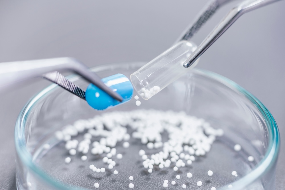 Pharmacist creates personalized medication at a compounding pharmacy.